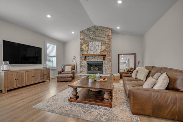 7192 Winfrey Dr, Fairview, TN 37062 - living area featuring wood finished floors, lofted ceiling, a stone fireplace, and recessed lighting