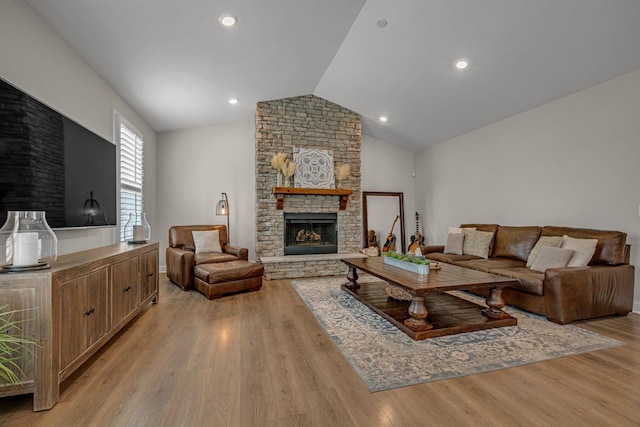 7192 Winfrey Dr, Fairview, TN 37062 - living area with a stone fireplace, light wood finished floors, and lofted ceiling