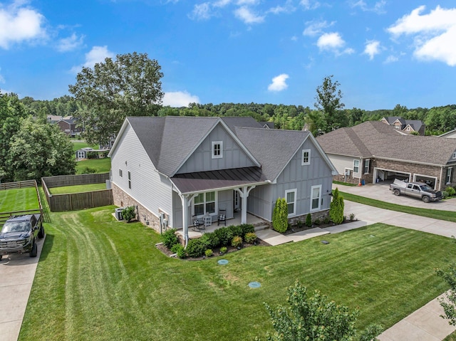 7192 Winfrey Dr, Fairview, TN 37062 - view of front of house with stone siding, board and batten siding, concrete driveway, and a standing seam roof