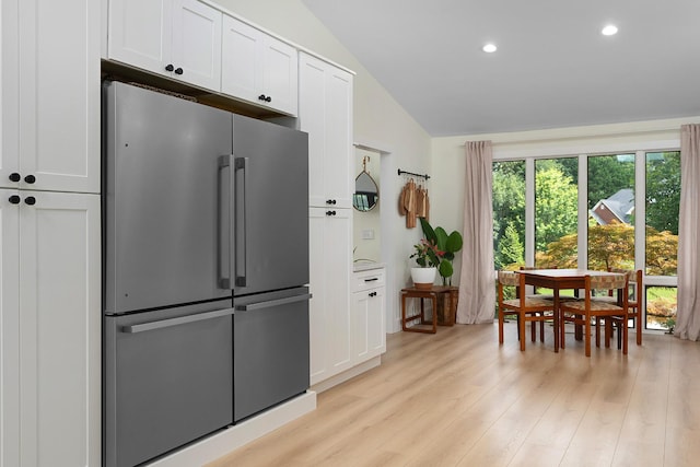 9208 Windstone Dr, Ooltewah, TN 37363 - kitchen with high end fridge, vaulted ceiling, white cabinets, recessed lighting, and light wood-style floors