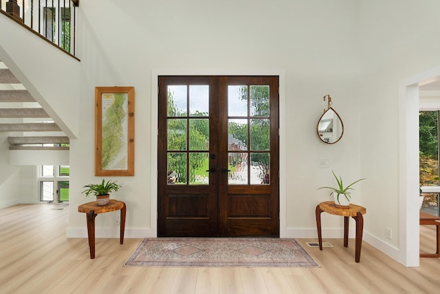 9208 Windstone Dr, Ooltewah, TN 37363 - entrance foyer featuring wood finished floors, plenty of natural light, and french doors