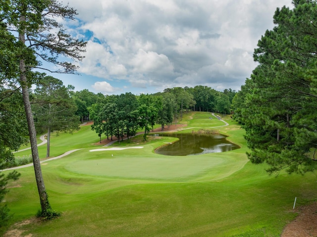 9208 Windstone Dr, Ooltewah, TN 37363 - view of home's community with a water view, view of scattered trees, a lawn, and golf course view