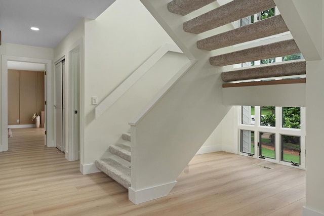 9208 Windstone Dr, Ooltewah, TN 37363 - stairway with wood finished floors, healthy amount of natural light, and recessed lighting