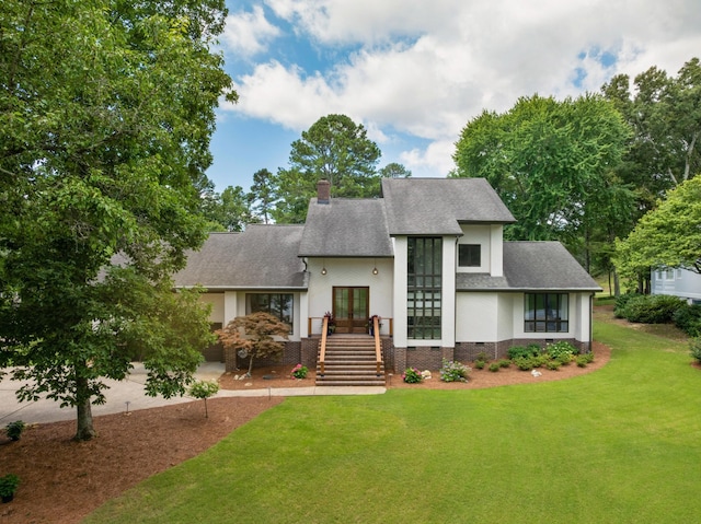 9208 Windstone Dr, Ooltewah, TN 37363 - view of front of house with roof with shingles, stairway, a front lawn, and a chimney