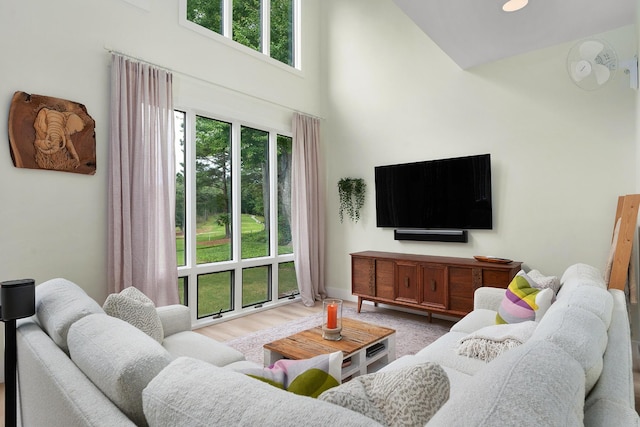 9208 Windstone Dr, Ooltewah, TN 37363 - living area with a towering ceiling and wood finished floors
