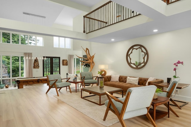 9208 Windstone Dr, Ooltewah, TN 37363 - living area with a towering ceiling, french doors, light wood finished floors, and recessed lighting