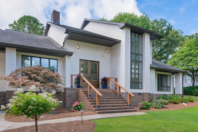 9208 Windstone Dr, Ooltewah, TN 37363 - view of front of home featuring a chimney, a front lawn, and a shingled roof