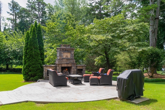 9208 Windstone Dr, Ooltewah, TN 37363 - view of patio with grilling area, an outdoor living space with a fireplace, and view of wooded area