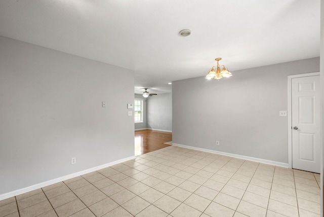3366 N Henderson Way, Clarksville, TN 37042 - empty room with a chandelier, ceiling fan, and light tile patterned floors