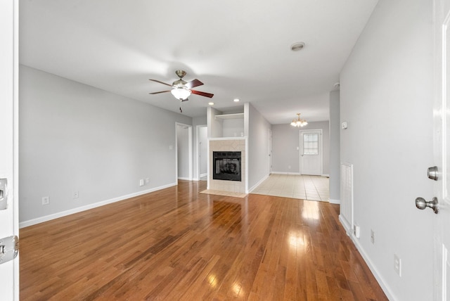 3366 N Henderson Way, Clarksville, TN 37042 - unfurnished living room with ceiling fan, light wood-type flooring, a fireplace, and recessed lighting