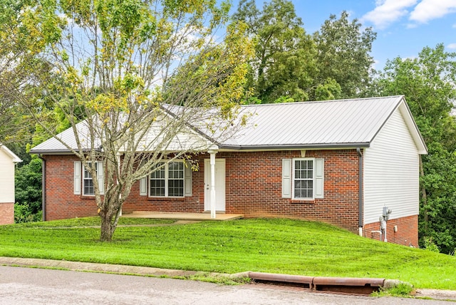 3366 N Henderson Way, Clarksville, TN 37042 - ranch-style house with a front yard, brick siding, and a metal roof