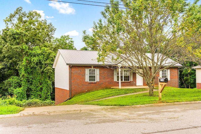 3366 N Henderson Way, Clarksville, TN 37042 - ranch-style house featuring brick siding, a front lawn, and a metal roof