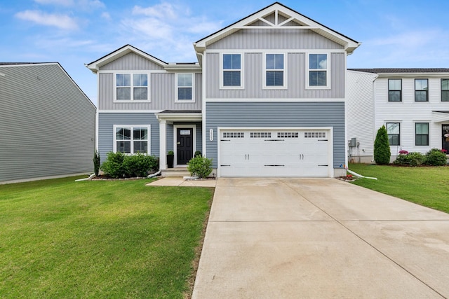 1802 Quail Run Way, Spring Hill, TN 37174 - view of front of property featuring board and batten siding, concrete driveway, a front yard, and a garage