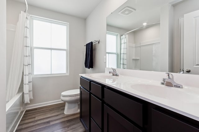 1802 Quail Run Way, Spring Hill, TN 37174 - bathroom featuring double vanity, wood finished floors, and shower / tub combo