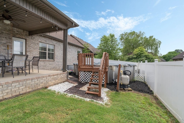 1640 Drayton Dr, Murfreesboro, TN 37130 - fenced backyard featuring a deck, a ceiling fan, and a patio