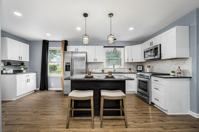2422 Choctaw Trce, Murfreesboro, TN 37129 - kitchen with stainless steel appliances, white cabinetry, tasteful backsplash, and recessed lighting