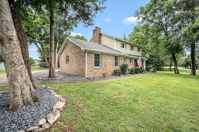2422 Choctaw Trce, Murfreesboro, TN 37129 - view of front of house with a chimney, brick siding, a front lawn, and a shingled roof