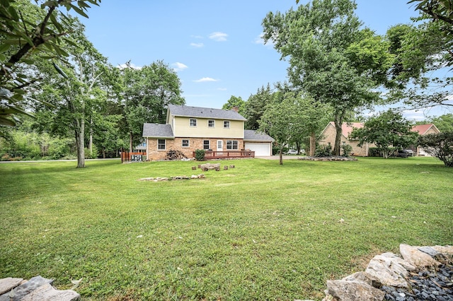 2422 Choctaw Trce, Murfreesboro, TN 37129 - view of green lawn with a wooden deck and a detached garage