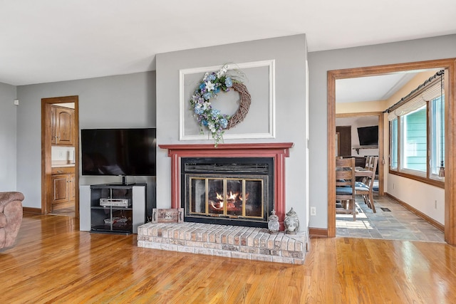 40 Lakeview Trl, Mcminnville, TN 37110 - living area featuring wood finished floors and a brick fireplace