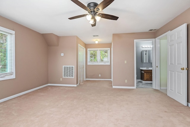 40 Lakeview Trl, Mcminnville, TN 37110 - unfurnished bedroom featuring light colored carpet, ensuite bathroom, and ceiling fan