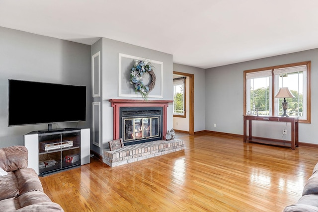40 Lakeview Trl, Mcminnville, TN 37110 - living room featuring wood finished floors, plenty of natural light, and a fireplace