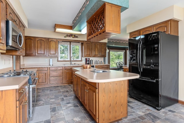 40 Lakeview Trl, Mcminnville, TN 37110 - kitchen with appliances with stainless steel finishes, stone finish floors, light countertops, and brown cabinets
