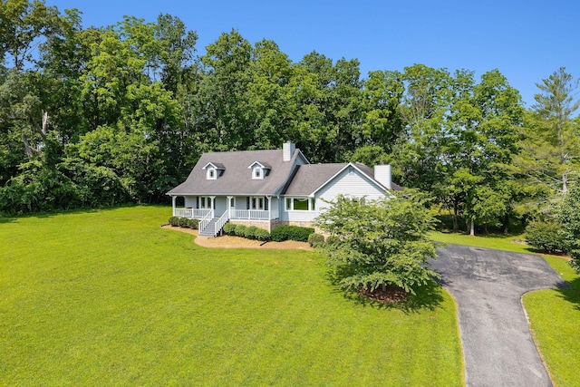40 Lakeview Trl, Mcminnville, TN 37110 - cape cod home featuring covered porch, a chimney, a front yard, and asphalt driveway