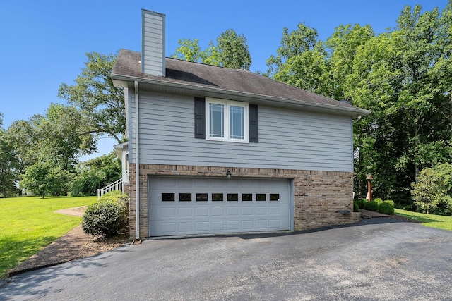 40 Lakeview Trl, Mcminnville, TN 37110 - view of property exterior featuring driveway, brick siding, a garage, a lawn, and a chimney