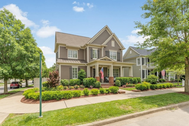 1202 Jewell Ave, Franklin, TN 37064 - craftsman-style house featuring a standing seam roof, a metal roof, a front yard, and covered porch