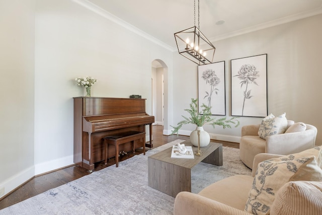 1202 Jewell Ave, Franklin, TN 37064 - living area featuring arched walkways, crown molding, wood finished floors, and a chandelier