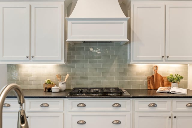 1202 Jewell Ave, Franklin, TN 37064 - kitchen with stainless steel gas cooktop, custom exhaust hood, and white cabinetry