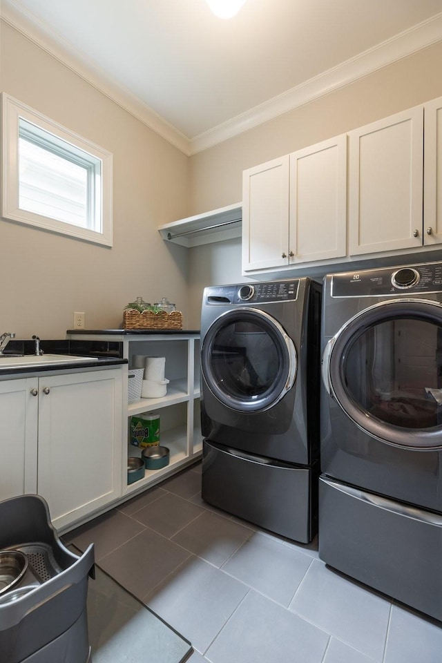 1202 Jewell Ave, Franklin, TN 37064 - washroom with cabinet space, ornamental molding, washing machine and dryer, and tile patterned floors