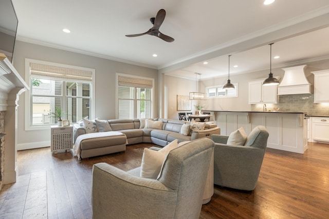 1202 Jewell Ave, Franklin, TN 37064 - living area featuring plenty of natural light, wood-type flooring, a ceiling fan, crown molding, and a fireplace