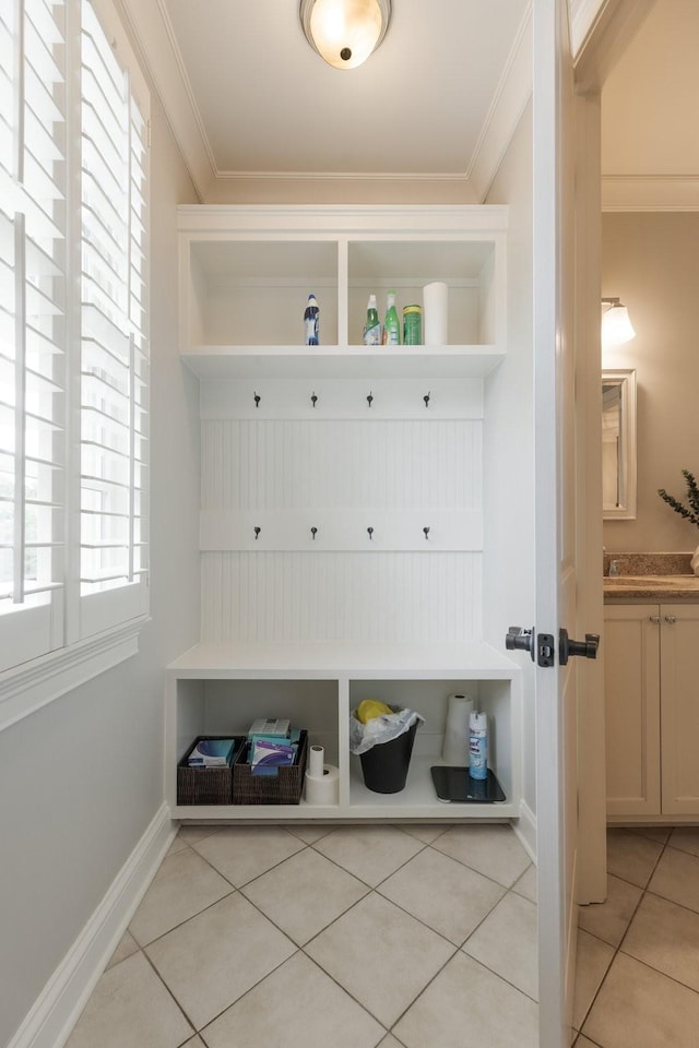 1202 Jewell Ave, Franklin, TN 37064 - mudroom featuring light tile patterned floors and crown molding