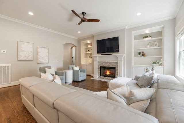 1202 Jewell Ave, Franklin, TN 37064 - living area with arched walkways, ceiling fan, ornamental molding, dark wood-type flooring, and built in features