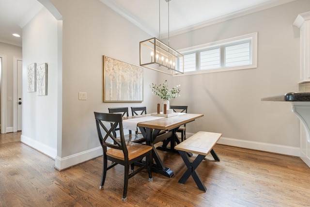1202 Jewell Ave, Franklin, TN 37064 - dining area with arched walkways, crown molding, wood finished floors, recessed lighting, and a chandelier