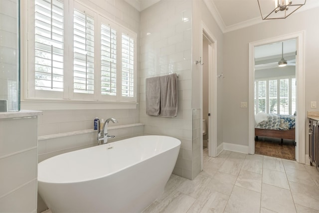1202 Jewell Ave, Franklin, TN 37064 - ensuite bathroom featuring plenty of natural light, a soaking tub, ornamental molding, marble finish flooring, and a chandelier