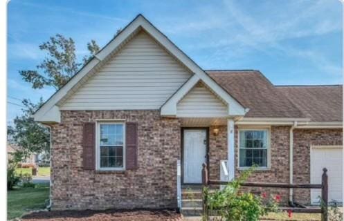 1544 Heritage View Blvd, Madison, TN 37115 - view of front facade with an attached garage and brick siding