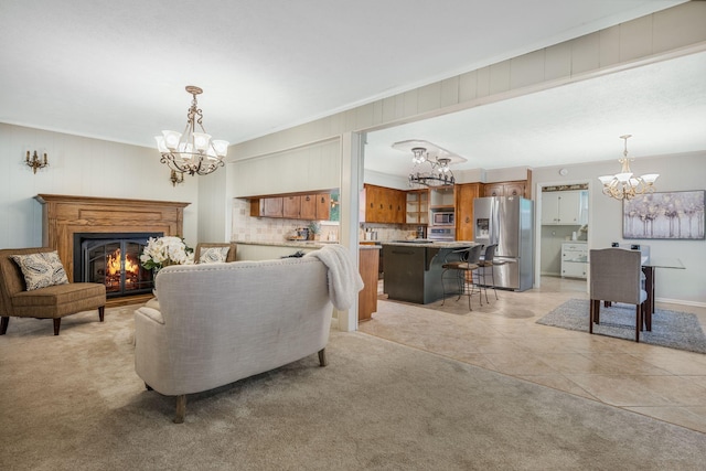 305 E Overhill Dr, Dickson, TN 37055 - living room with a chandelier, a lit fireplace, light carpet, light tile patterned flooring, and crown molding