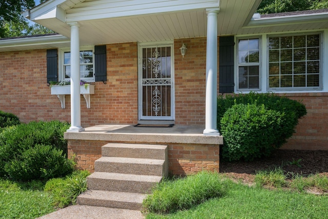 305 E Overhill Dr, Dickson, TN 37055 - view of exterior entry with a porch and brick siding