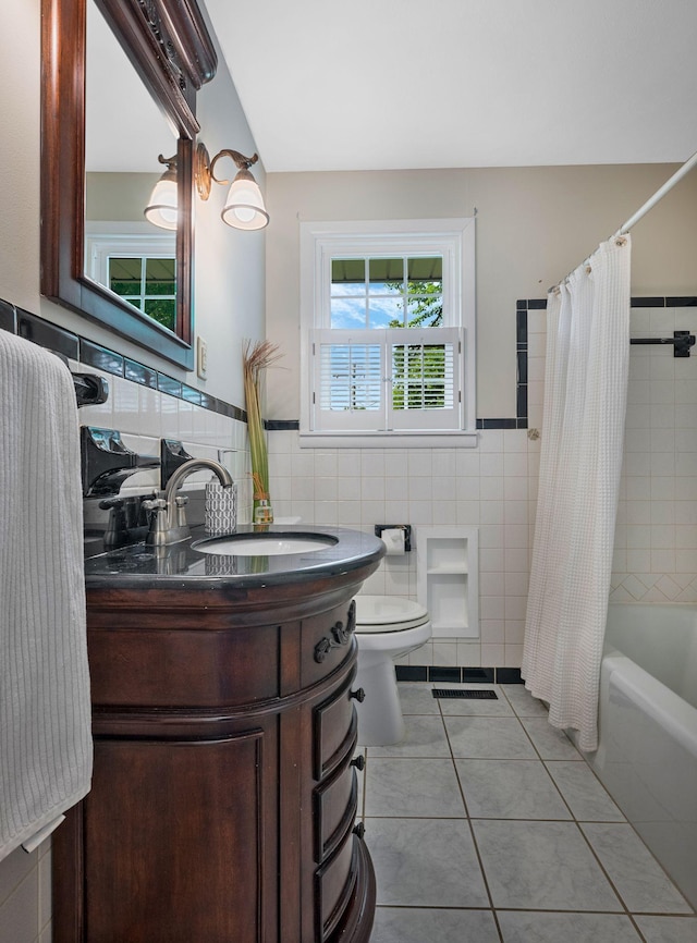 305 E Overhill Dr, Dickson, TN 37055 - full bath with vanity, tile walls, shower / tub combo with curtain, tile patterned flooring, and wainscoting