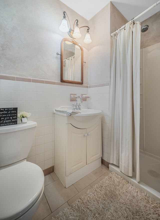 305 E Overhill Dr, Dickson, TN 37055 - bathroom featuring vanity, tile patterned floors, tile walls, curtained shower, and wainscoting