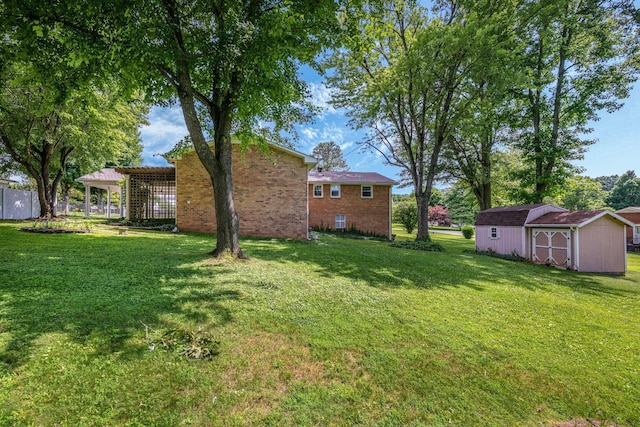 305 E Overhill Dr, Dickson, TN 37055 - view of grassy yard with a storage unit