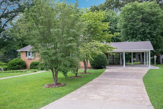 305 E Overhill Dr, Dickson, TN 37055 - surrounding community with driveway, a lawn, and a carport