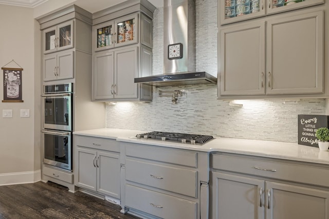 9488 Stillbrook Trce, Brentwood, TN 37027 - kitchen with gray cabinets, appliances with stainless steel finishes, wall chimney exhaust hood, and dark wood finished floors