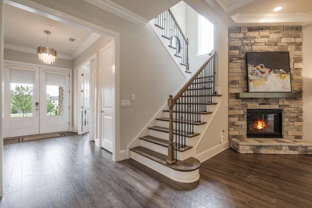 9488 Stillbrook Trce, Brentwood, TN 37027 - entrance foyer featuring dark wood-style floors, plenty of natural light, stairs, crown molding, and a fireplace