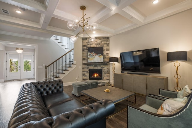 9488 Stillbrook Trce, Brentwood, TN 37027 - living area featuring a chandelier, stairs, wood finished floors, beam ceiling, and a stone fireplace