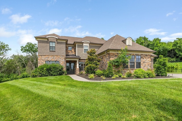 9488 Stillbrook Trce, Brentwood, TN 37027 - view of front of house featuring french doors, stone siding, a front yard, and roof with shingles