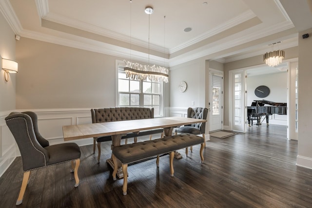 9488 Stillbrook Trce, Brentwood, TN 37027 - dining room featuring a raised ceiling, dark wood-style floors, a decorative wall, a chandelier, and ornamental molding