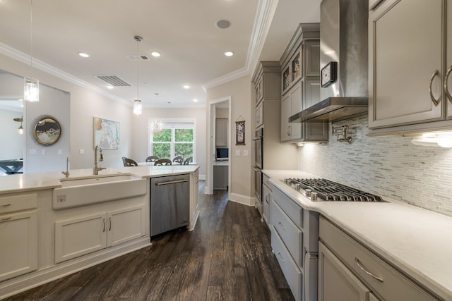 9488 Stillbrook Trce, Brentwood, TN 37027 - kitchen with stainless steel appliances, wall chimney exhaust hood, dark wood-style floors, ornamental molding, and light countertops